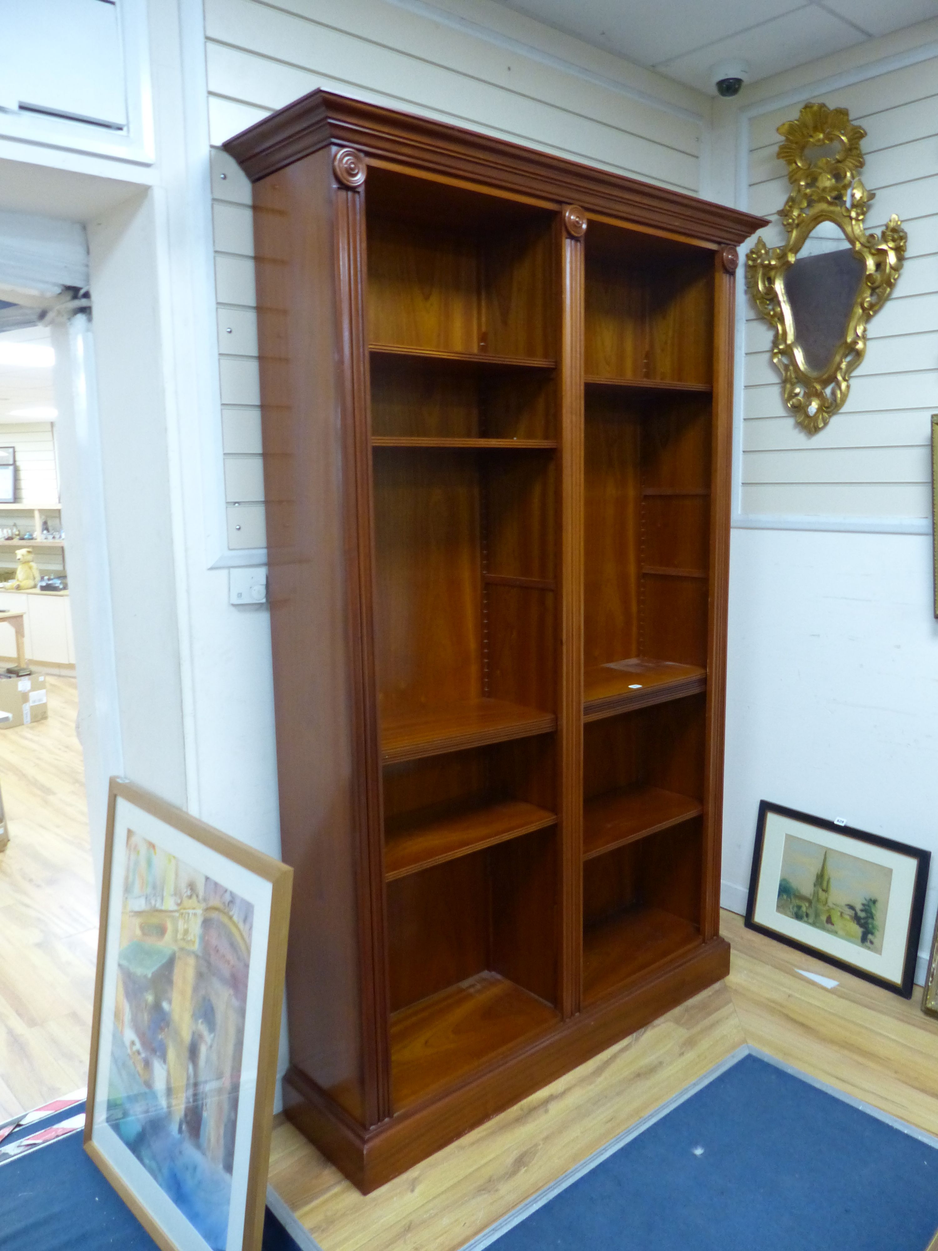 A Regency style mahogany open bookcase, width 136cm, depth 38cm, height 214cm